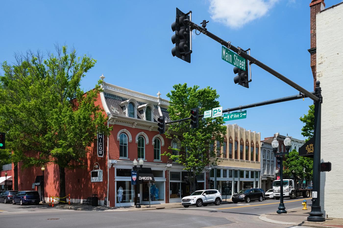 Main Street in downtown Franklin, Tennessee, showing the historic brick storefronts and business district Schneidman Law serves